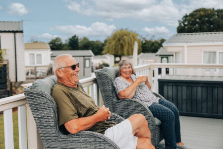 holiday home owners drinking tea on veranda