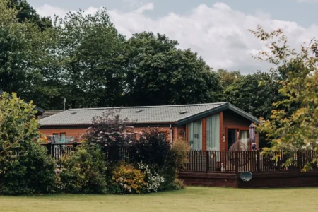 lodge surrounded by grounds at Merley house
