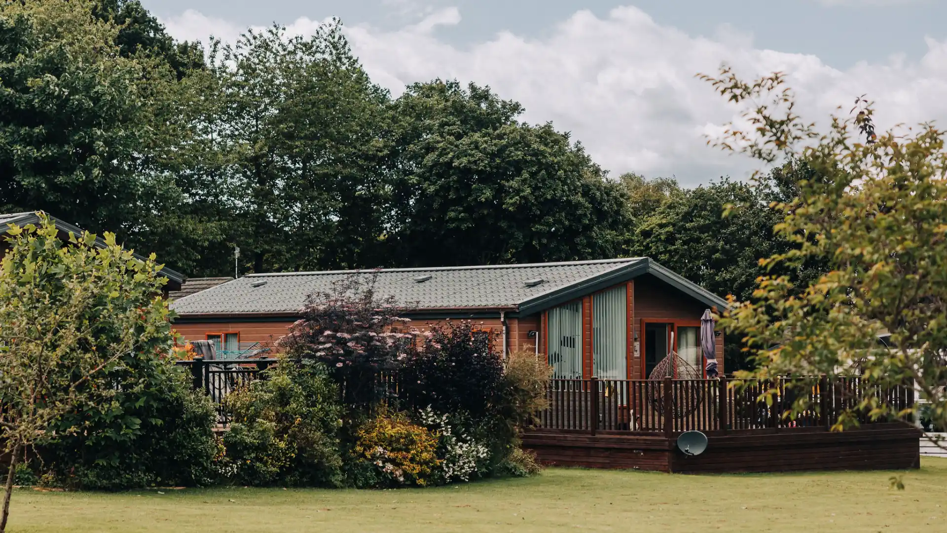 lodge surrounded by grounds at Merley house